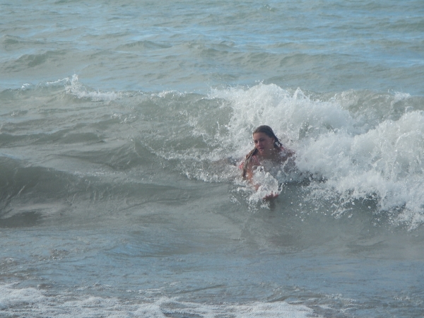 2019 Madi rides on top a wave