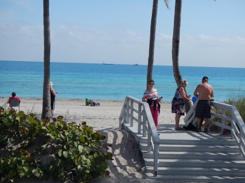 Kathy poses at one of the countless entrances
        to the beaches of Fort Lauderdale
