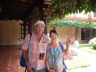 Brian and Kathy pose in front
            of Bill and Marys place