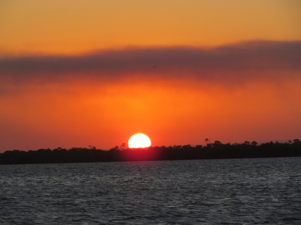 The
              Sun Sets over a cay on the Belize off shore Barrier Reel