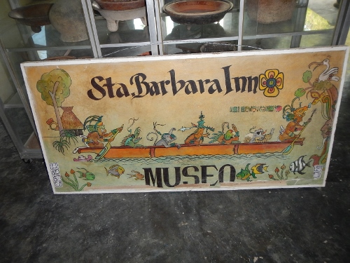 A sign in the museum
          depicting the seven Mayan Gods